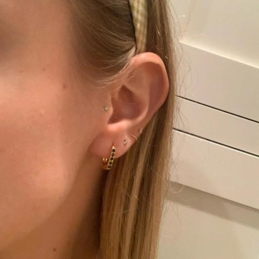 The Jade gold oval hoop earrings with dark green studded gems hoops carabiner